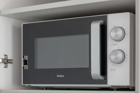 Bright kitchen with cooking utensils.