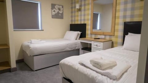Standard Twin Room | Blackout drapes, iron/ironing board, free WiFi, bed sheets