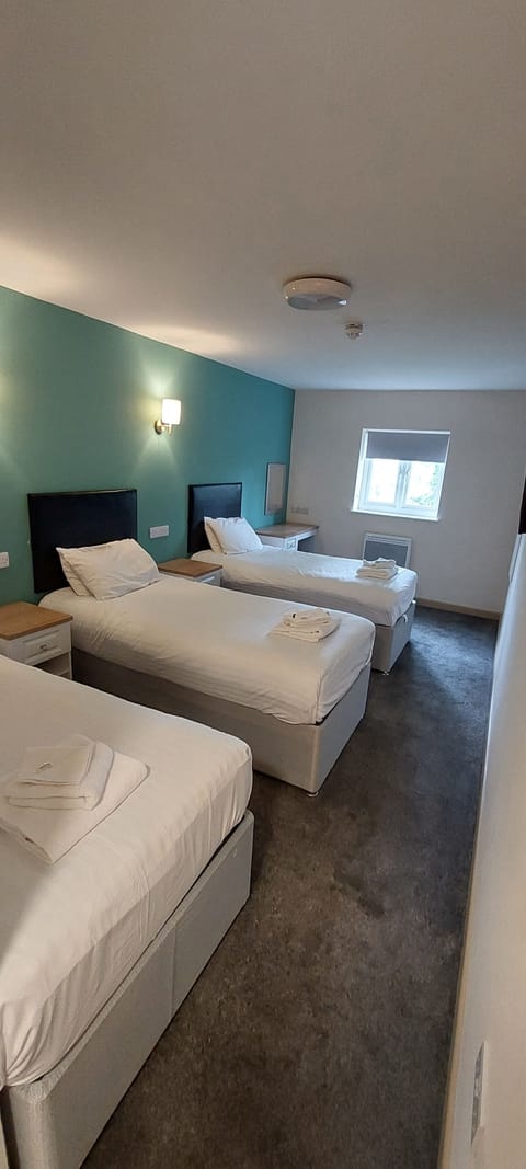 Room, Multiple Beds, Non Smoking | Desk, laptop workspace, free WiFi