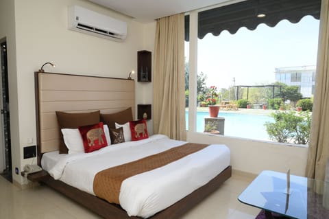 Premium Double Room, Pool View | In-room safe, desk, free WiFi, bed sheets