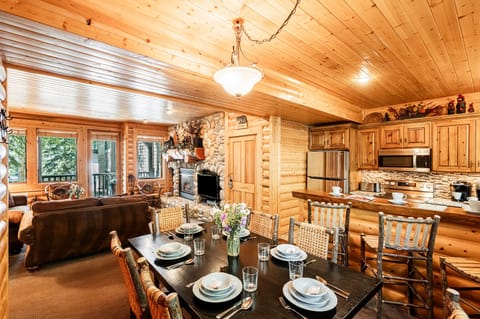 Dining area with seating for six and a closet with a stacked washer/dryer