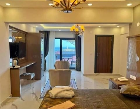 Deluxe Suite, Balcony, Sea View | In-room safe, blackout drapes, free WiFi
