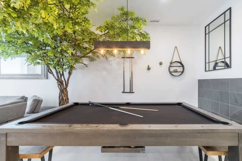 Versatile dining table that easily transforms into a billiard table for added fun and entertainment.