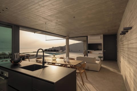 Fully equipped kitchen, with a dining table, comfortably seating 6 guests