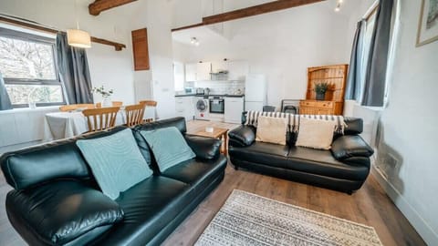 Experience the perfect social hub in our bright, open-plan living area, seamlessly connecting the kitchen, dining, and lounge spaces.
