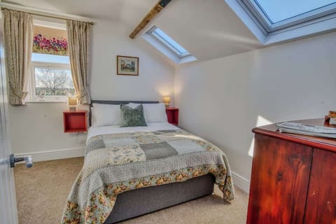 "Sleep soundly in the second bedroom, complete with a comfortable double bed, stylish touches, and a peaceful ambiance for a perfect retreat."