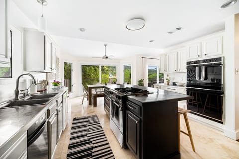 Effortless elegance in the kitchen with comfortable bar seating.