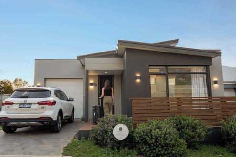 Contemporary architecture and landscaped surrounds create an impressive welcome, while convenient driveway parking makes arriving and settling in effortless.