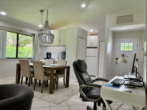 The office work desk is located in the general are between the living room and dining area. A comfortable desk chair and monitor gives you a great place to get work done if needed.
