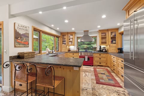 Kitchen with stainless steel appliances and breakfast bar