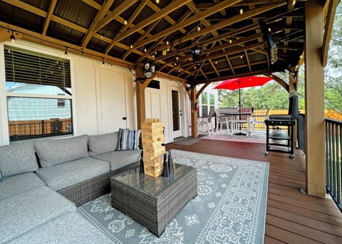 Relax and enjoy coffee or a cocktail on the spacious covered patio.