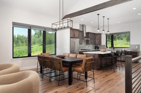 Open concept main level with dining area and large, fully equipped kitchen