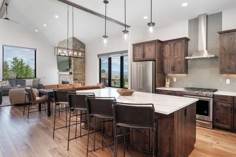 Open concept main level with dining area and large, fully equipped kitchen