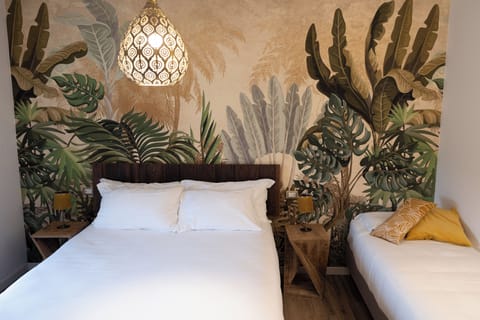 Deluxe Triple Room, Pool View | Minibar, in-room safe, desk, laptop workspace