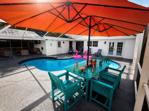 Screened private pool with shaded dining and fun resort-style vibes
