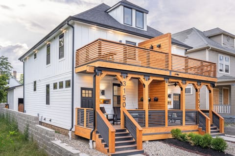 Custom front façade with two-story terrace. Guests have access to the left side unit of the duplex.