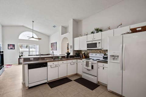 Fully equipped kitchen with appliances for cooking needs
