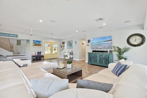 Spacious living area bright, coastal living space filled with cozy vibes and charming decor!