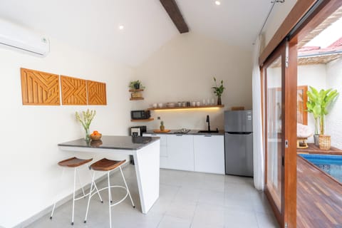 Premium Villa, Pool View | Private kitchen | Full-size fridge, microwave, stovetop, electric kettle