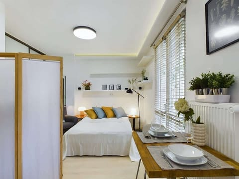 Living area with a comfortable double bed.