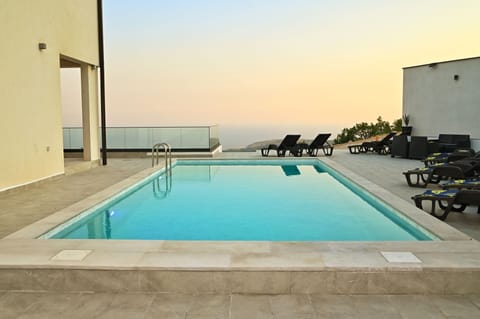 Exclusive Villa | Living area | Flat-screen TV, video-game console