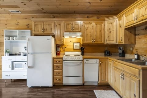 Kitchen with appliances and utensils to bring home-cooking to your cabin..