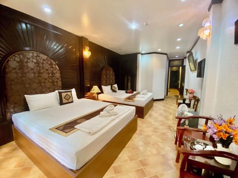 Family Quadruple Room, City View | Premium bedding, individually decorated, individually furnished, desk