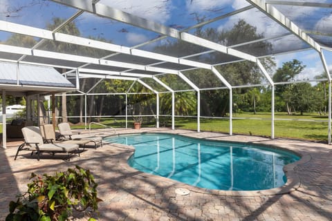 Lagoon style caged pool. Entrance located off of living room.