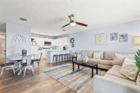 Spacious living room with 2 comfy couches. Enjoy the ceiling fan, smart TV