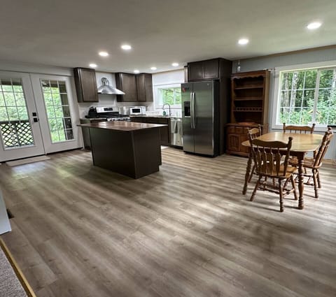 Kitchen with access to covered deck and grill