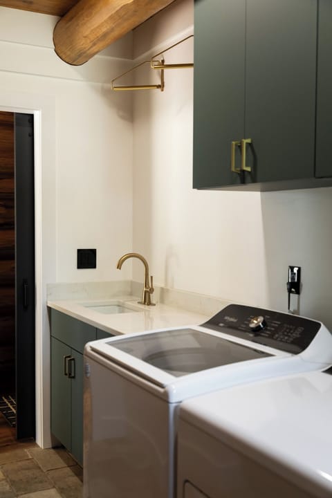 Clothes hanging rack above the laundry sink