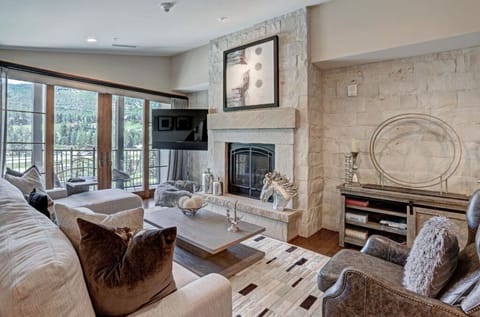 Elegant living room with a cozy fireplace and comfortable seating.