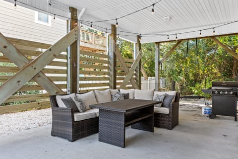 Enjoy dinner from the grill on this patio while kids swing on the swing. Or enjoy the evening string light ambience.