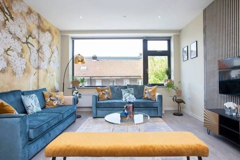 Integrated living, bedroom, and kitchen spaces in an open layout.