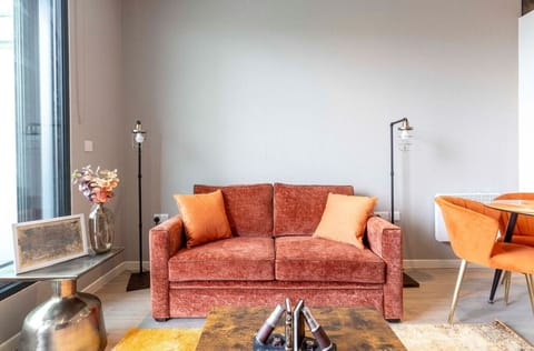 Integrated living and kitchen spaces in an open layout with direct access to a private terrace.