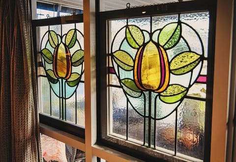 vintage stain glass in bedroom windows