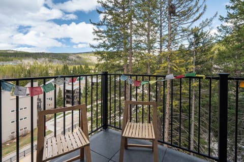 - Balcony with forest views creates a peaceful retreat   - Enjoy fresh mountain air while relaxing in cozy seating   - Scenic outdoor corner perfect for morning coffee or evening unwinding