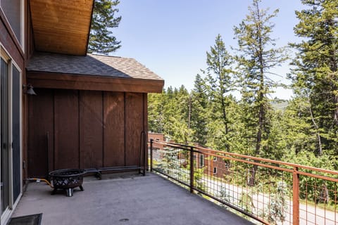 - Spacious deck with railing and forest views  
- Plenty of room for outdoor seating or grilling  
- Surrounded by nature and mountain scenery
