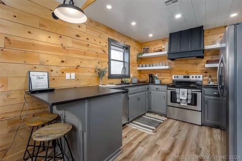 The well-stocked kitchen has the utensils, pots, pans, and skillets you'll need.