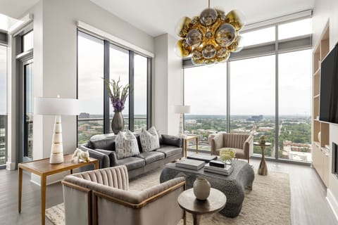 Living room featuring a 65" 4K UHD TV