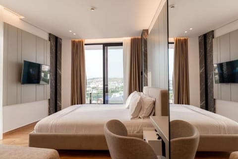 Junior Suite with Balcony and Sea View | Minibar, in-room safe, desk, blackout drapes