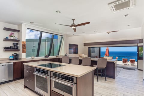 Living Kitchen - Puu Poa 407 is an end unit condo on the top floor with ample light and brand new fixtures.