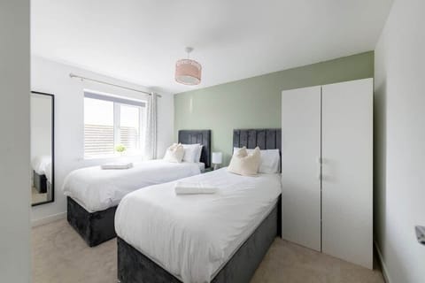 "Perfect for friends or family—our twin single beds offer comfort, space, and a restful night’s sleep for every guest."