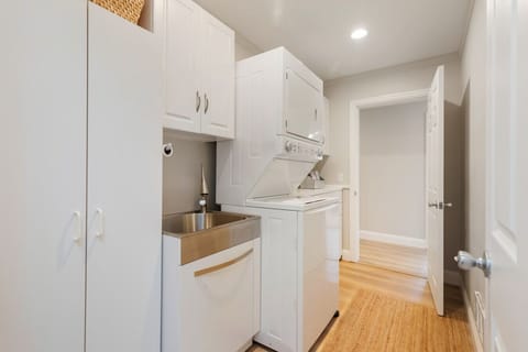 Full size laundry room with stackable washer & dryer
