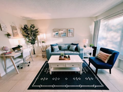 Living Room

Sun-drench living area equipped with a comfortable leatherette sofa bed, coastal vibes, a work desk, 50" smart TV, and a dining table for 4 people. Free Wi-Fi is included to work and watch your favorite streaming services.