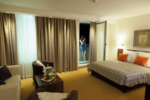 Junior Room | Desk, laptop workspace, blackout drapes, iron/ironing board