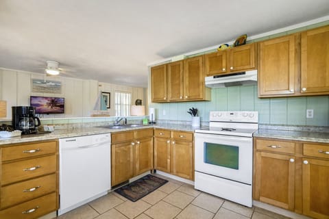 A large and open kitchen is fully stocked with everything you need