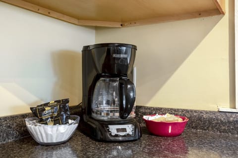 Drip coffee maker and coffee with suger and creamer are provided