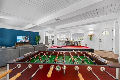 This vibrant area features a beautifully crafted pool table, perfect for both casual games and more serious matches.