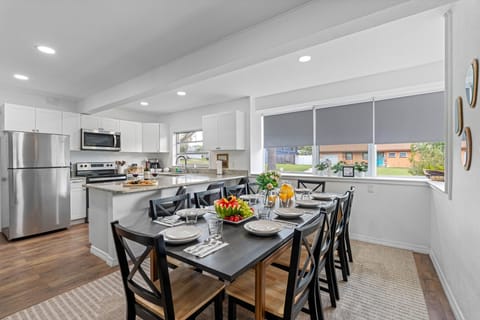 The open layout of the kitchen allows it to flow seamlessly into the adjoining living and dining areas, making it the heart of the home where everyone can gather.